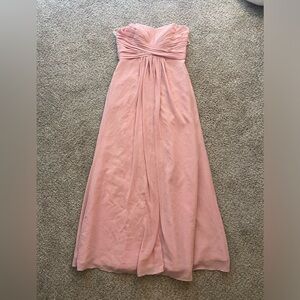 Pink strapless dress with a sweetheart neckline and a pleated skirt